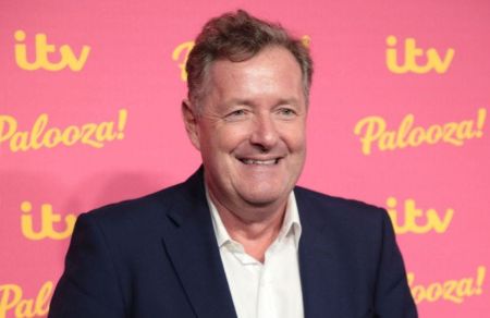 Piers Morgan smiling at the camera during an ITV event.